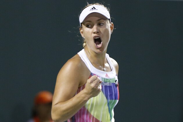 Angelique Kerber, of Germany celebrates after defeating Madison Keys, of the United States, at the Miami Open tennis tournament in Key Biscayne, Fla., Wednesday, March 30, 2016. Kerber won 6-3, 6-2. (AP Photo/Joel Auerbach)