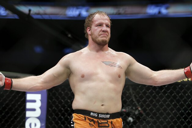 Jared Rosholt celebrates a TKO win in three rounds over Josh Copeland during a men's heavyweight UFC bout, Saturday, March 14, 2015, in Dallas. (AP Photo/Brandon Wade)