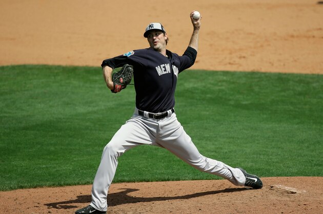 New York Yankees' Andrew Miller pitches against the Atlanta Braves in a spring training baseball game, Wednesday, March 30, 2016, in Kissimmee, Fla. Miller was struck on the right arm by a line drive after the pitch, forcing the left-handed reliever to leave the game. (AP Photo/John Raoux)