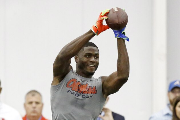 Wide receiver Laquon Treadwell reaches for a pass during drills at Mississippi's NFL football Pro Day, Monday, March 28, 2016, in Oxford, Miss. The event is to showcase players for the upcoming NFL football draft. (AP Photo/Rogelio V. Solis)