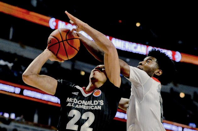 West forward Josh Jackson, right, from Justin-Siena high school/Prolific Prep Academy in Napa, Calif., blocks East  forward Jayson Tatum from Chaminade College Preparatory school in St. Louis during the McDonald's All-American boys basketball game, Wednesday, March 30, 2016, in Chicago. (AP Photo/Matt Marton)