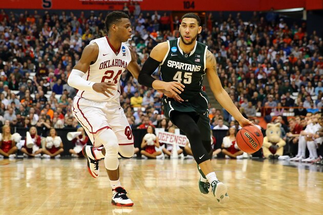 SYRACUSE, NY - MARCH 27:  Denzel Valentine #45 of the Michigan State Spartans dribbles in the second half of the game against Buddy Hield #24 of the Oklahoma Sooners during the East Regional Semifinal of the 2015 NCAA Men's Basketball Tournament at the Carrier Dome on March 27, 2015 in Syracuse, New York.  (Photo by Maddie Meyer/Getty Images)