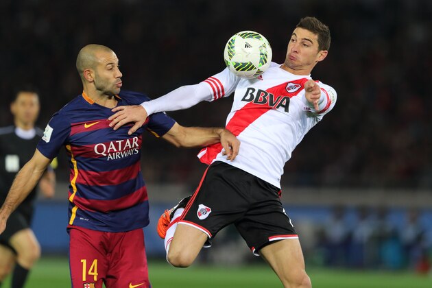 YOKOHAMA, JAPAN - DECEMBER 20: Javier Mascherano of FC Barcelona and Lucas Alario of River Plate during the FIFA Club World Cup Final Match between FC Barcelona and River Plate at International Stadium Yokohama on December 20, 2015 in Yokohama, Japan.  (Photo by Matthew Ashton - AMA/Getty Images)