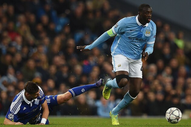 Manchester City's Ivorian midfielder and captain Yaya Toure (R) evades a challenge from Dynamo Kiev's Austrian defender Aleksandar Dragovic during a UEFA Champions League last 16, second leg football match between Manchester City and Dynamo Kiev at the Etihad Stadium in Manchester, north west England, on March 15, 2016. / AFP / PAUL ELLIS        (Photo credit should read PAUL ELLIS/AFP/Getty Images)