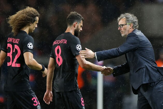 PSG headcoach Laurent Blanc, right, congratulates PSG's Thiago Motta, center, and PSG's David Luiz after the Champions League Group A soccer match between PSG and Malmo at the Parc des Princes stadium in Paris, France, Tuesday, Sept. 15, 2015. PSG won 2-0. (AP Photo/Francois Mori)