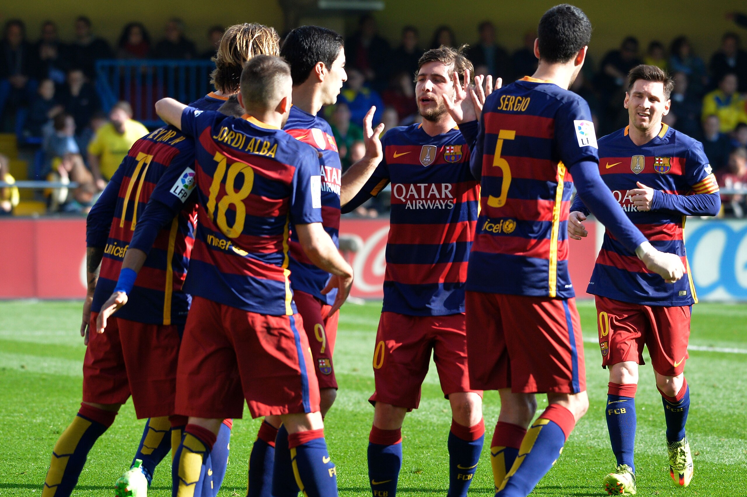 Barcelona's players celebrate a second goal during the Spanish league football match Villarreal CF vs FC Barcelona at El Madrigal stadium in Vila-real on March 20, 2016. / AFP / JOSE JORDAN        (Photo credit should read JOSE JORDAN/AFP/Getty Images)