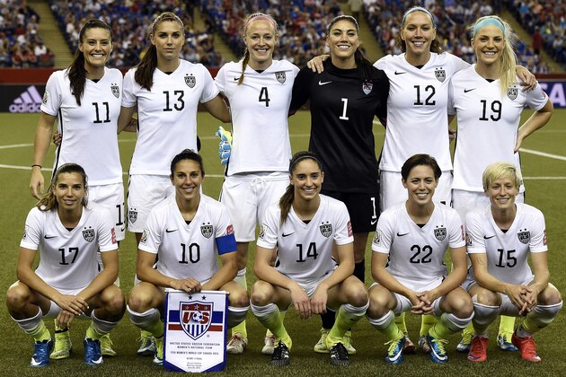 (TOP ROW FROM LEFT): USA defender Ali Krieger, forward Alex Morgan, defender Becky Sauerbrunn, goalkeeper Hope Solo, midfielder Lauren Holiday and defender Julie Johnston. (BOTTOM ROW FRO LEFT):  USA midfielder Tobin Heath, midfielder Carli Lloyd, midfielder Morgan Brian, defender Meghan Klingenberg and midfielder Megan Rapinoe pose during the semi-final football match between USA and Germany during their 2015 FIFA Women's World Cup at the Olympic Stadium in Montreal on June 30, 2015. USA won 2-0.     AFP PHOTO / FRANCK FIFE        (Photo credit should read FRANCK FIFE/AFP/Getty Images)