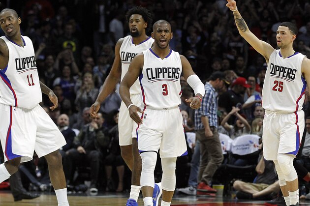 Los Angeles Clippers guard Chris Paul (3), center DeAndre Jordan, second from left, and guard Austin Rivers (25) celebrate a 3-point shot by guard Jamal Crawford, left, against the Portland Trail Blazers during the second half of an NBA basketball game in Los Angeles, Thursday, March 24, 2016. The Clippers won 96-94. (AP Photo/Alex Gallardo)