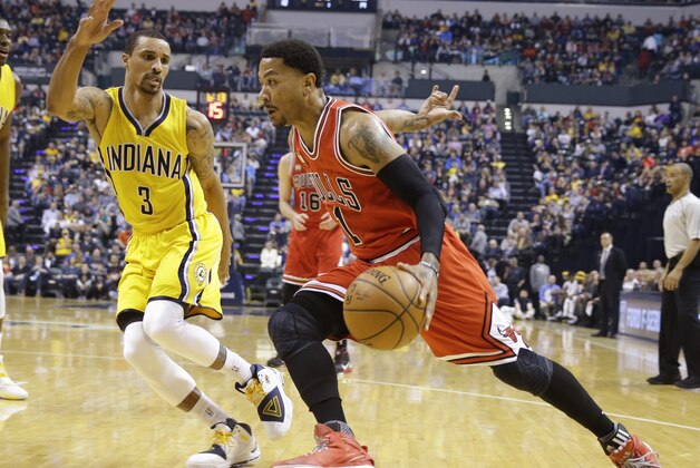 Chicago Bulls guard Derrick Rose (1) drives on Indiana Pacers guard George Hill (3) during the first half of an NBA basketball game in Indianapolis, Tuesday, March 29, 2016. (AP Photo/Michael Conroy)