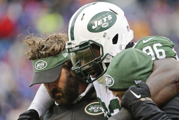 New York Jets defensive end Muhammad Wilkerson (96) is helped off the field after being hurt on a play during the second half of an NFL football game against the Buffalo Bills, Sunday, Jan. 3, 2016, in Orchard Park, N.Y. (AP Photo/Bill Wippert)