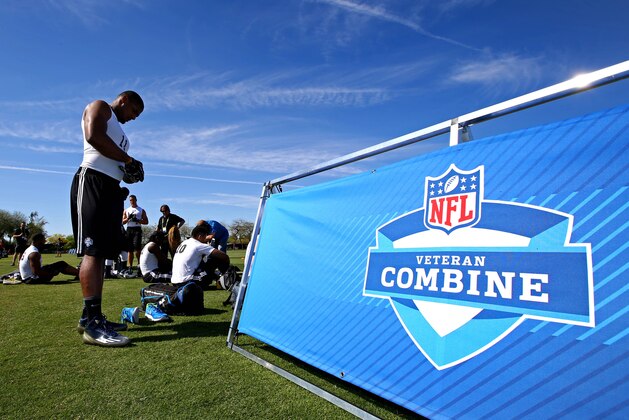 Mar 22, 2015; Tempe, AZ, USA; Defensive end Michael Sam (left) prepares to participate in drills during the NFL Veteran Combine at the Arizona Cardinals training facility. Mandatory Credit: Mark J. Rebilas-USA TODAY Sports