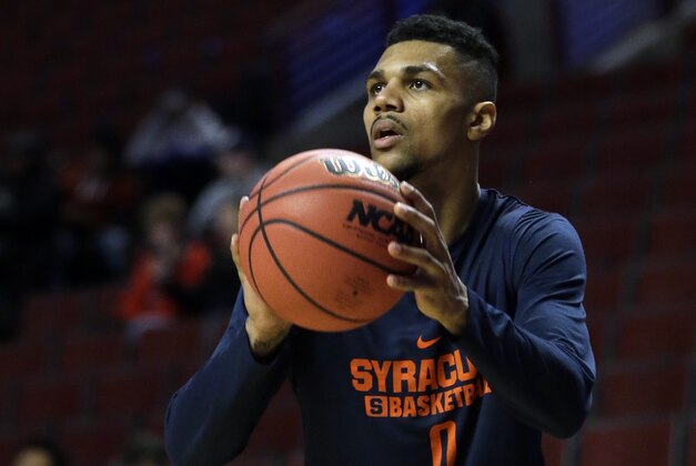 Syracuse's Michael Gbinije (0) shoots during college basketball practice, Thursday, March 24, 2016, in Chicago. Syracuse plays against Gonzaga in a regional semifinal game in the NCAA Tournament on Friday. (AP Photo/Nam Y. Huh)