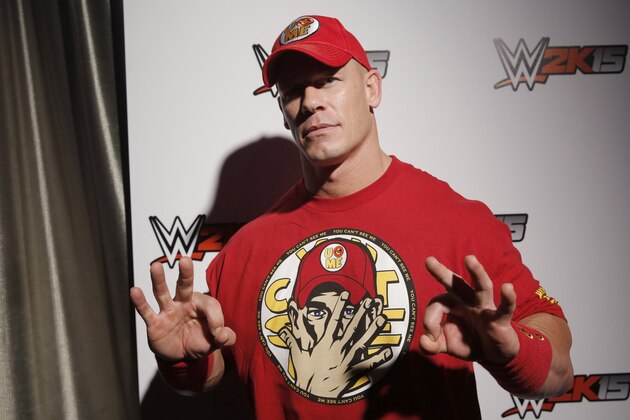 WWE 2K15 cover Superstar John Cena attends the WWE 2K15 SummerSlam Confidential Panel at Club Nokia, on Saturday, August 16, 2014 in Los Angeles. (Photo by Todd Williamson/Invision for 2K/AP Images)