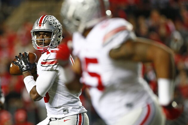 PISCATAWAY, NJ - OCTOBER 24: Quarterback J.T. Barrett #16 of the Ohio State Buckeyes looks to pass to Marcus Baugh #85 during the second quarter against the Rutgers Scarlet Knights at High Point Solutions Stadium on October 24, 2015 in Piscataway, New Jersey. Ohio State defeated Rutgers 49-7. (Photo by Rich Schultz /Getty Images)
