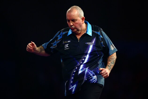 LONDON, ENGLAND - DECEMBER 30:  Phil Taylor of England looks dejected in his third round match against Jelle Klaasen of the Netherlands on Day Twelve of the 2016 William Hill PDC World Darts Championships at Alexandra Palace on December 30, 2015 in London, England.  (Photo by Jordan Mansfield/Getty Images)