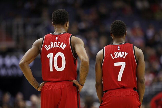 Toronto Raptors guards DeMar DeRozan (10) and Kyle Lowry (7) stand during the second half of an NBA basketball game against the Washington Wizards, Friday, Jan. 8, 2016, in Washington. The Raptors won 97-88. (AP Photo/Alex Brandon)
