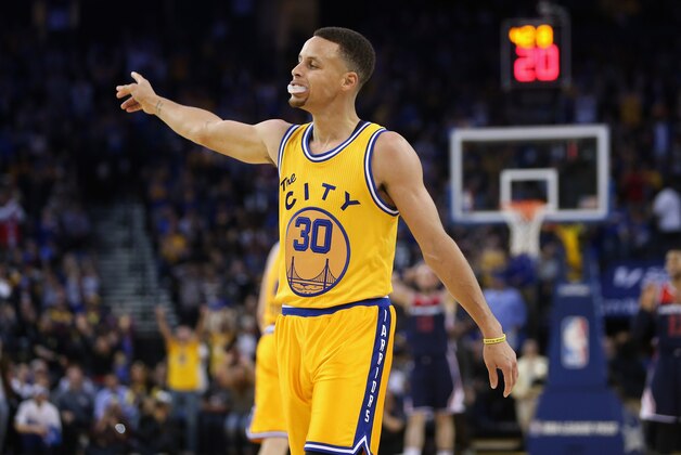 OAKLAND, CA - MARCH 29:  Stephen Curry #30 of the Golden State Warriors gets the crowd louder during their game against the Washington Wizards at ORACLE Arena on March 29, 2016 in Oakland, California. NOTE TO USER: User expressly acknowledges and agrees that, by downloading and or using this photograph, User is consenting to the terms and conditions of the Getty Images License Agreement.  (Photo by Ezra Shaw/Getty Images)