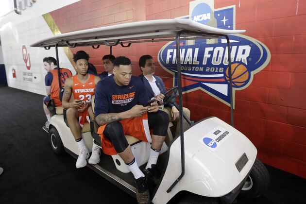 Syracuse players make their way to the court for a closed practice session for the NCAA Final Four college basketball tournament Thursday, March 31, 2016, in Houston. (AP Photo/Eric Gay)