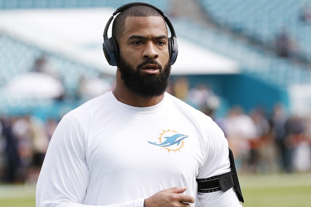 Miami Dolphins linebacker Spencer Paysinger (42) warms up before an NFL football game against the Baltimore Ravens, Sunday, Dec. 6, 2015, in Miami Gardens, Fla.  (AP Photo/Wilfredo Lee)