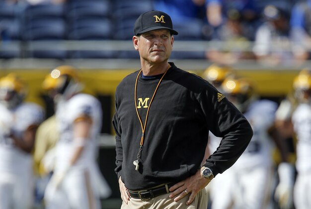 Jan 1, 2016; Orlando, FL, USA; Michigan Wolverines head coach Jim Harbaugh looks at his players before the 2016 Citrus Bowl against the Florida Gators at Orlando Citrus Bowl Stadium. Mandatory Credit: Reinhold Matay-USA TODAY Sports