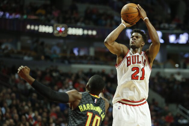 Mar 28, 2016; Chicago, IL, USA; Chicago Bulls guard Jimmy Butler (21) shoots against Atlanta Hawks guard Tim Hardaway Jr. (10) during the second half at United Center. Mandatory Credit: Kamil Krzaczynski-USA TODAY Sports