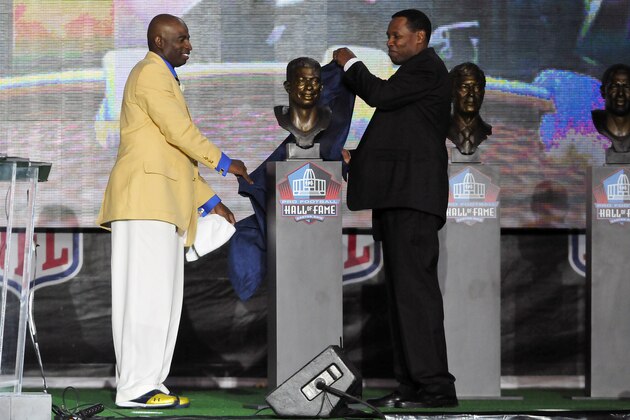 CANTON, OH - AUGUST 6: Former Atlanta Falcons cornerback Deion Sanders (L) and his agent Eugene Parker unveil Sanders' bust at the Enshrinement Ceremony for the Pro Football Hall of Fame on August 6, 2011 in Canton, Ohio. (Photo by Jason Miller/Getty Images)