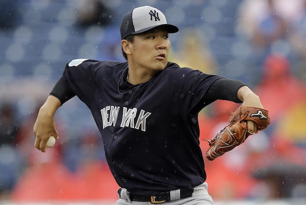 New York Yankees starting pitcher Masahiro Tanaka, of Japan, goes into his wind up against the Philadelphia Phillies during the first inning of a spring training baseball game Tuesday, March 29, 2016, in Clearwater, Fla. (AP Photo/Chris O'Meara)