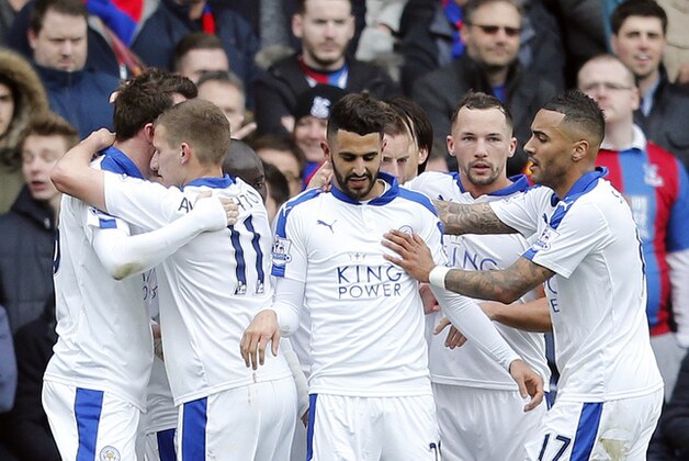 Leicester players celebrate after scoring during the English Premier League soccer match between Crystal Palace and Leicester City at Selhurst Park stadium in London, Saturday, March 19, 2016.(AP Photo/Frank Augstein)