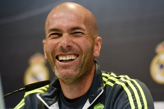 Real Madrid's French coach Zinedine Zidane laughs during a press conference at Real Madrid sport city in Madrid on April 1, 2016 on the eve of their Spanish League 'El Clasico' football match FC Barcelona vs Real Madrid CF. / AFP / JAVIER SORIANO        (Photo credit should read JAVIER SORIANO/AFP/Getty Images)