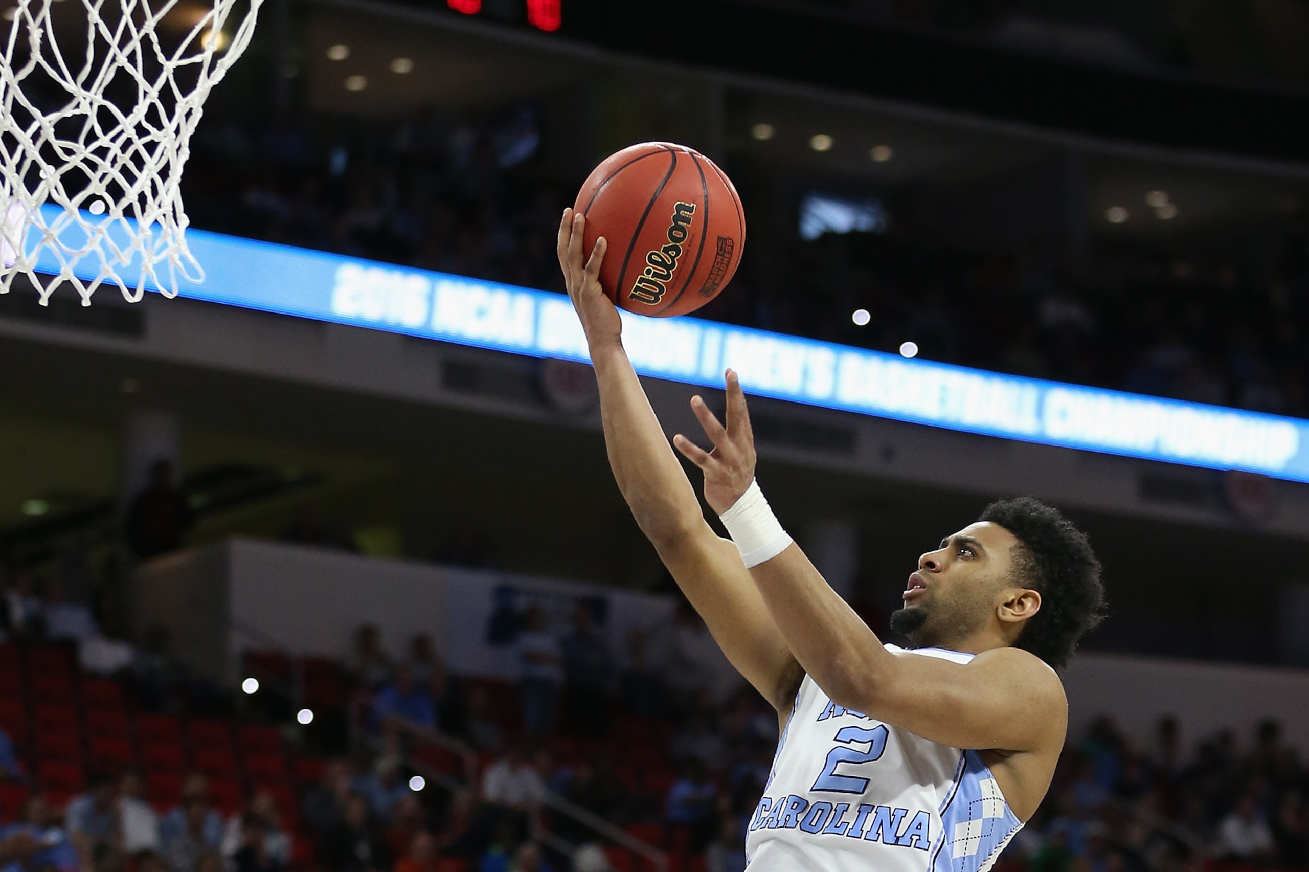 RALEIGH, NC - MARCH 19: Joel Berry II #2 of the North Carolina Tar Heels goes for a layup against the Providence Friars in the second half during the second round of the 2016 NCAA Men's Basketball Tournament at PNC Arena on March 19, 2016 in Raleigh, North Carolina.  The North Carolina Tar Heels won 85-66.  (Photo by Streeter Lecka/Getty Images)
