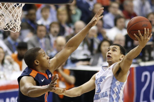 North Carolina guard Marcus Paige shoots against Virginia guard Devon Hall during the second half of an NCAA college basketball game for the championship of the Atlantic Coast Conference men's tournament, Saturday, March 12, 2016, in Washington. North Carolina defeated Virginia 61-57. (AP Photo/Steve Helber)