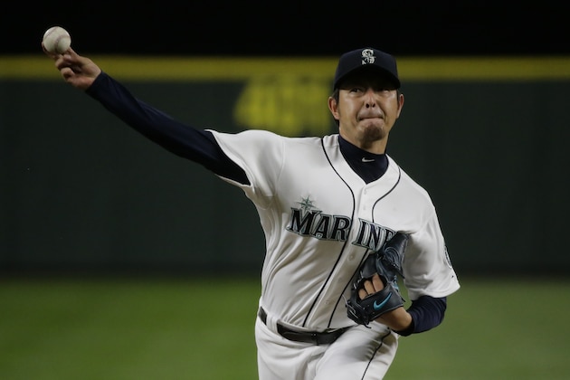 Seattle Mariners starting pitcher Hisashi Iwakuma throws against the Los Angeles Angels during a baseball game, Wednesday, Sept. 16, 2015, in Seattle. (AP Photo/Ted S. Warren)