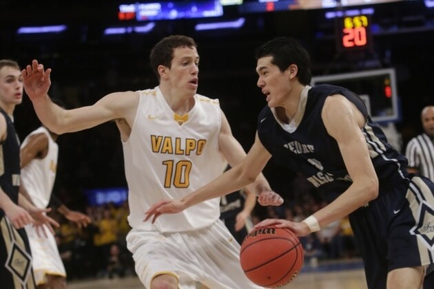 George Washington's Yuta Watanabe (12), of Japan, drives past Valparaiso's David Skara (10) during the second half of an NCAA college basketball game in the finals of the NIT Thursday, March 31, 2016, in New York. George Washington won 76-60. (AP Photo/Frank Franklin II)