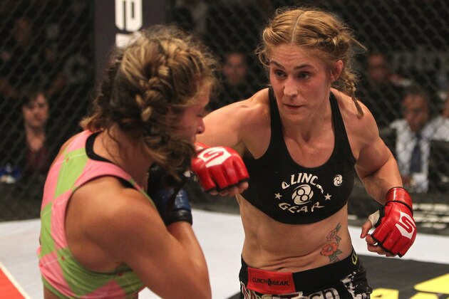 HOFFMAN ESTATES, IL - JULY 30:  (R-L) Marloes Coenen punches Miesha Tate during the Women's Bantamweight Championship fight at the Strikeforce event at Sears Centre Arena on July 30, 2011 in Hoffman Estates, Illinois.  (Photo by Josh Hedges/Forza LLC/Forza LLC via Getty Images)