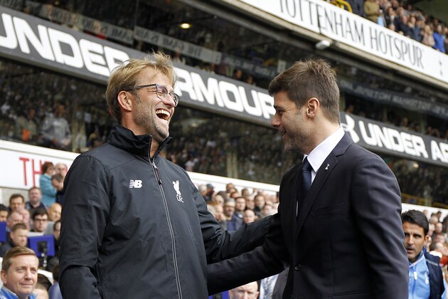 Liverpool's German manager Jurgen Klopp (L) is greeted by Tottenham Hotspur's Argentinian Head Coach Mauricio Pochettino (R) ahead of the English Premier League football match between Tottenham Hotspur and Liverpool at White Hart Lane in north London on October 17, 2015. AFP PHOTO / IAN KINGTON

RESTRICTED TO EDITORIAL USE. No use with unauthorized audio, video, data, fixture lists, club/league logos or 'live' services. Online in-match use limited to 75 images, no video emulation. No use in betting, games or single club/league/player publications.        (Photo credit should read IAN KINGTON/AFP/Getty Images)