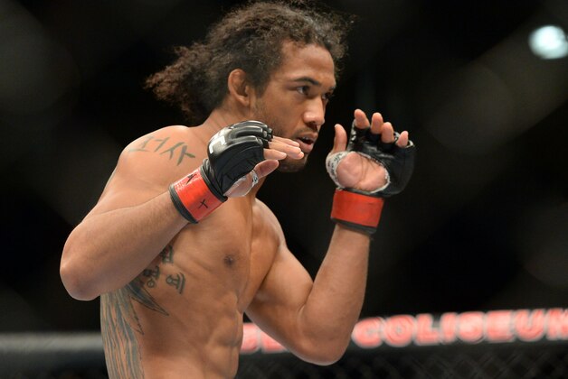 Jun 7, 2014; Albuquerque, NM, USA; Benson Henderson (red) and Rustam Khabilov (blue) fight during their lightweight bout during UFC Fight Night 42 at Tingley Coliseum. Henderson won via fourth round submission. Mandatory Credit: Joe Camporeale-USA TODAY Sports