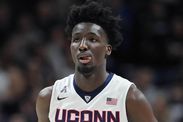 Connecticut's Daniel Hamilton reacts after hitting a three-point basket in the second half of an NCAA college basketball game against Houston, Sunday, Feb. 28, 2016, in Storrs, Conn. Houston won 75-68. (AP Photo/Jessica Hill)