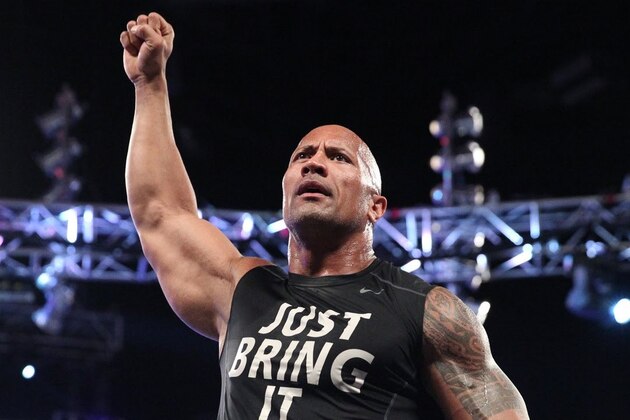 Dwayne Johnson aka The Rock reacts during Wrestlemania XXX at the Mercedes-Benz Super Dome in New Orleans on Sunday, April 6, 2014. (Jonathan Bachman/AP Images for WWE)
