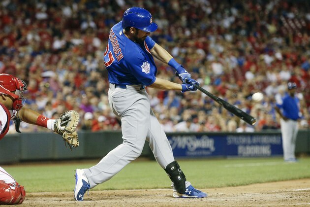 Chicago Cubs' Taylor Teagarden hits the game-winning RBI single off Cincinnati Reds relief pitcher Aroldis Chapman to drive in Anthony Rizzo in the eighth inning in the second game of a baseball doubeheader in Cincinnati, Wednesday, July 22, 2015. The Cubs won 6-5. (AP Photo/John Minchillo)