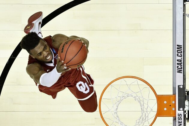 Oklahoma guard Buddy Hield scores against Oregon during the second half of an NCAA college basketball game in the regional finals of the NCAA Tournament, Saturday, March 26, 2016, in Anaheim, Calif. (AP Photo/Gregory Bull)