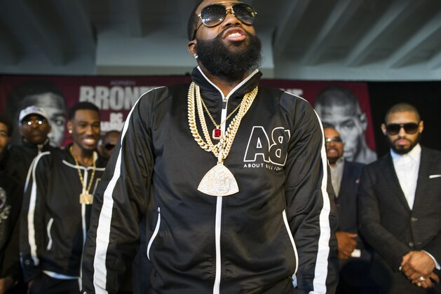 Four-division world champion Adrien Broner, center, taunts Ashley Theophane at a news conference in Washington, Monday, Feb. 29, 2016, ahead of their world title showdown. The fight is scheduled to be held at the D.C. Armory, April 1, 2016. (AP Photo/Cliff Owen)
