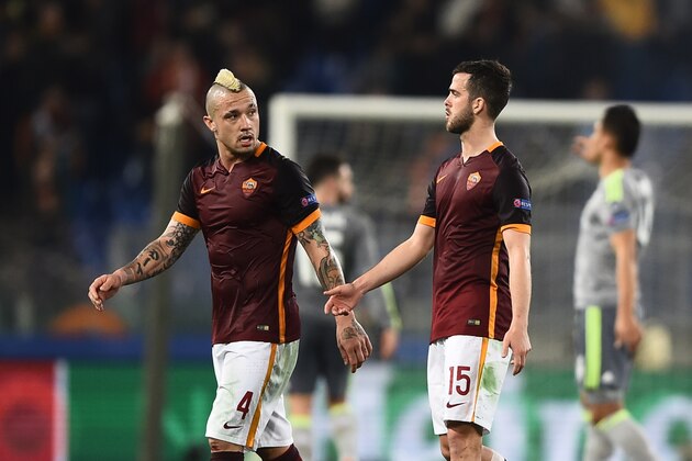 Roma's midfielder from Belgium Radja Nainggolan (L) and Roma's midfielder from Bosnia-Herzegovina Miralem Pjanic react at the end of the UEFA Champions League football match AS Roma vs Real Madrid on Frebruary 17, 2016 at the Olympic stadium in Rome.  Real Madrid won 0- 2.  AFP PHOTO / FILIPPO MONTEFORTE / AFP / FILIPPO MONTEFORTE        (Photo credit should read FILIPPO MONTEFORTE/AFP/Getty Images)
