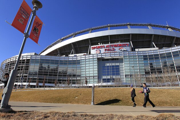 Fans walk outside of Sports Authority Field at Mile High before the NFL football AFC Championship game between the Denver Broncos and the New England Patriots, Sunday, Jan. 24, 2016, in Denver. (AP Photo/Joe Mahoney)