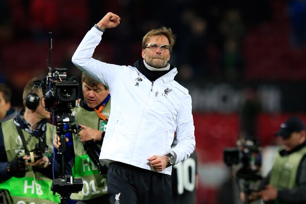 Liverpool manager Juergen Klopp celebrates at the end of the Europa League round of 16, second leg, soccer match between  Manchester United and Liverpool at Old Trafford Stadium in Manchester, England, Thursday March 17, 2016. (AP Photo/Jon Super)