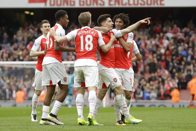 Arsenal's Hector Bellerin, second right, celebrates scoring his side's third goal during the English Premier League soccer match between Arsenal and Watford at the Emirates Stadium in London, Saturday, April 2, 2016.  (AP Photo/Matt Dunham)