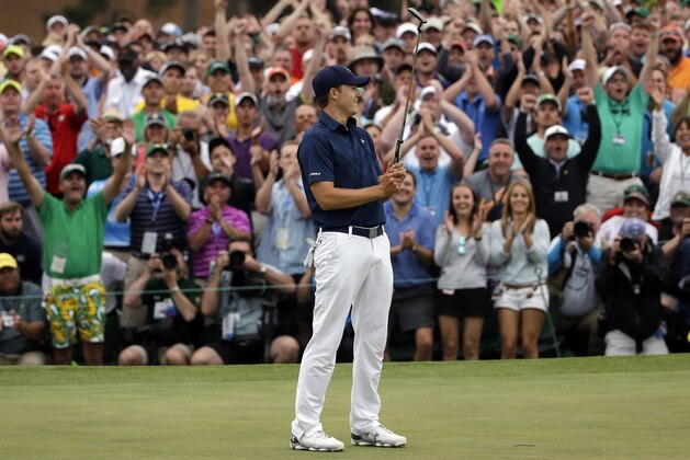 Jordan Spieth celebrates after winning the Masters golf tournament Sunday, April 12, 2015, in Augusta, Ga. (AP Photo/Matt Slocum)