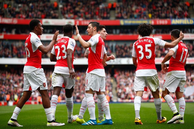 LONDON, ENGLAND - APRIL 02:  Alex Iwobi (1st L) of Arsenal celebrates scoring his team's second goal with his team mates during the Barclays Premier League match between Arsenal and Watford at Emirates Stadium on April 2, 2016 in London, England.  (Photo by Julian Finney/Getty Images)