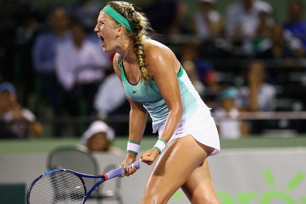 KEY BISCAYNE, FL - MARCH 31:  Victoria Azarenka of Belarus celebrates a point against Angelique Kerber of Germany in their semi final match during the Miami Open Presented by Itau at Crandon Park Tennis Center on March 31, 2016 in Key Biscayne, Florida.  (Photo by Clive Brunskill/Getty Images)