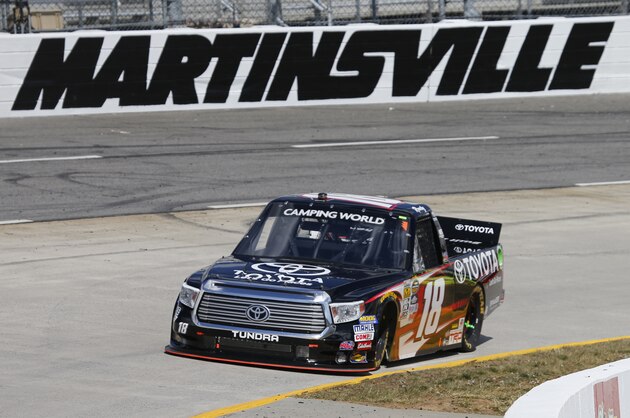 Kyle Busch (18) takes his truck through turn four during the NASCAR Camping World Truck race at the Martinsville Speedway Saturday, April 2, 2016 in Martinsville, Va. (AP Photo/Steve Helber)