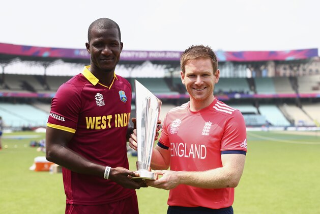 KOLKATA, WEST BENGAL - APRIL 02:   Darren Sammy of the West Indies and Eoin Morgan of England hold the trophy during previews ahead of the ICC World Twenty20 India Final between England and West Indies on April 2, 2016 in Kolkata, India.  (Photo by Ryan Pierse/Getty Images)
